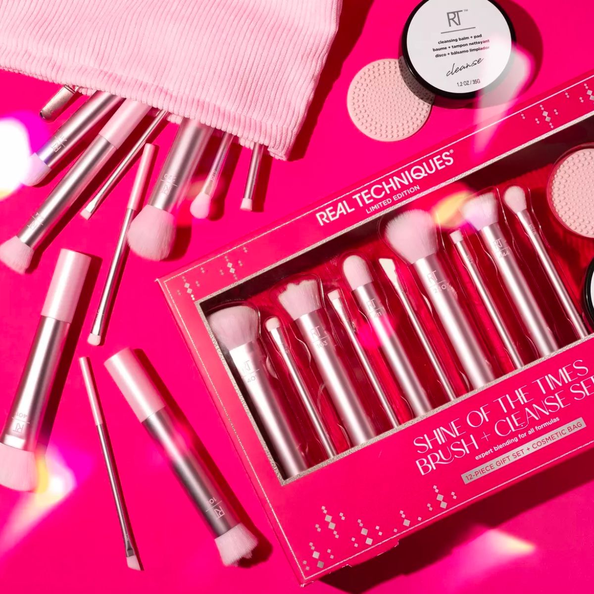 Real Techniques Shine of The Times 12-Piece Makeup Brush + Cleanse Gift Set displayed on a hot pink background