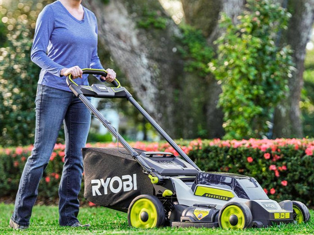woman using ryobi lawn mower