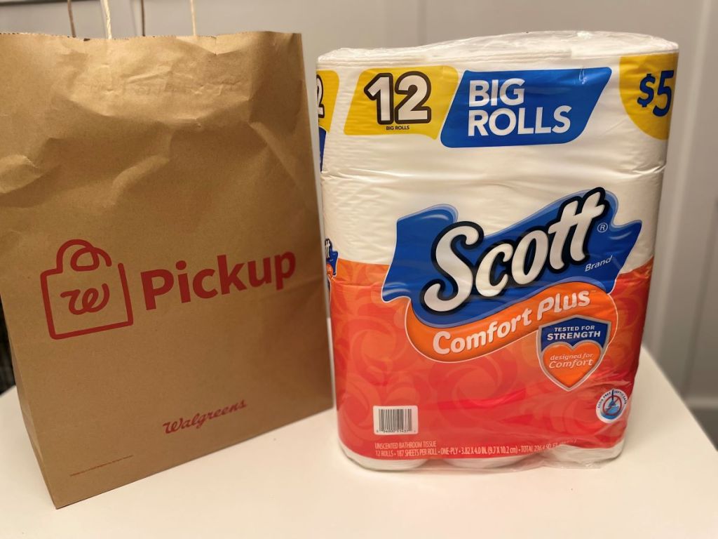 Package of Scott toilet paper next to a Walgreens bag