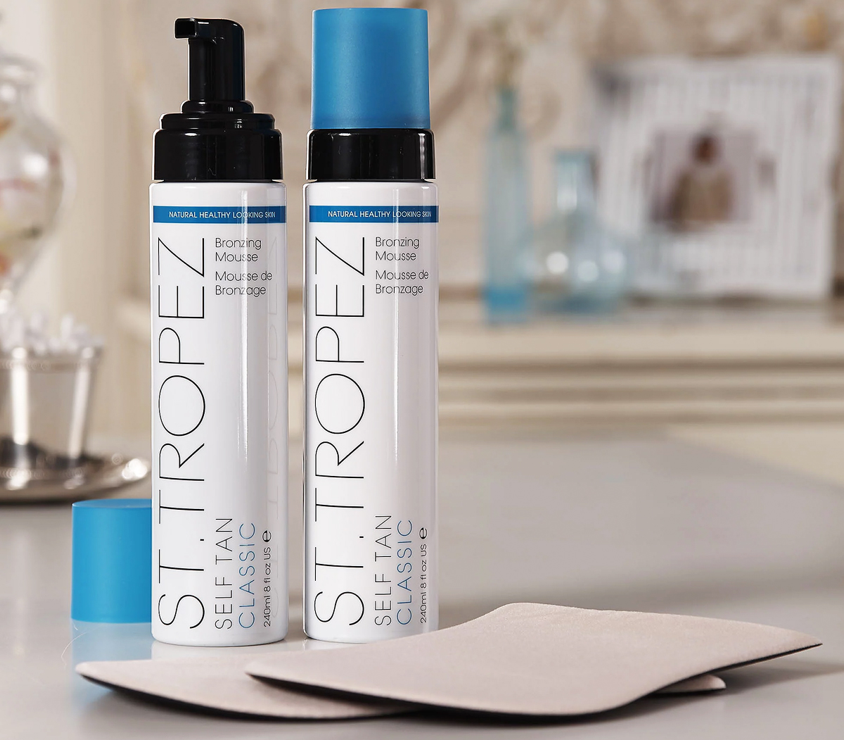 two bottles of st tropez tanning mousse and two mitts