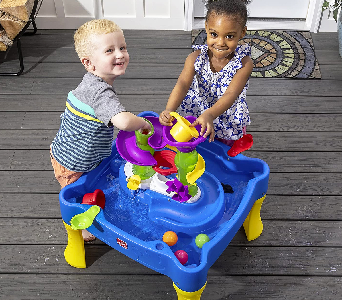 two toddlers playing at step2 water table