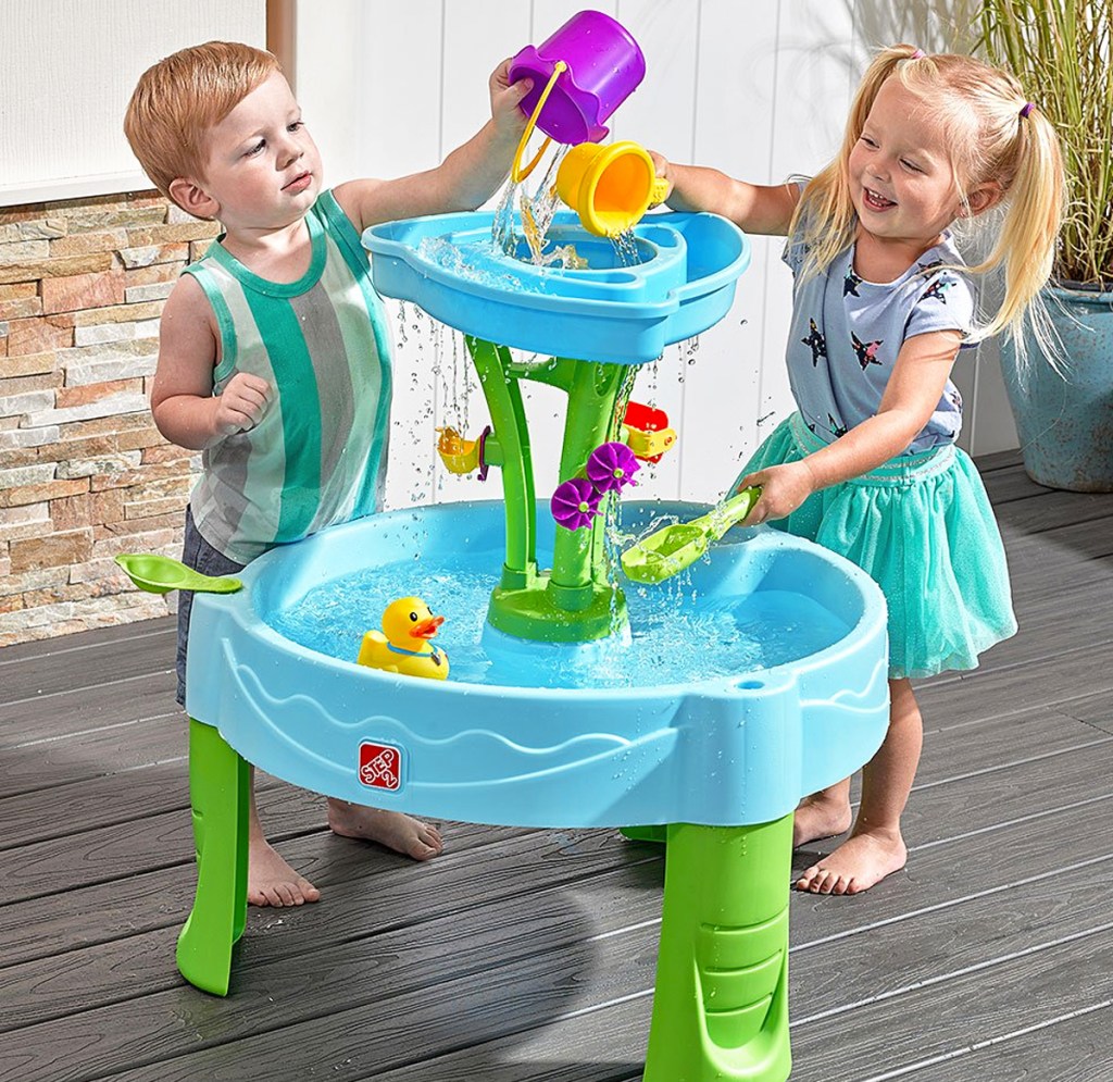 two toddlers playing at step2 water table
