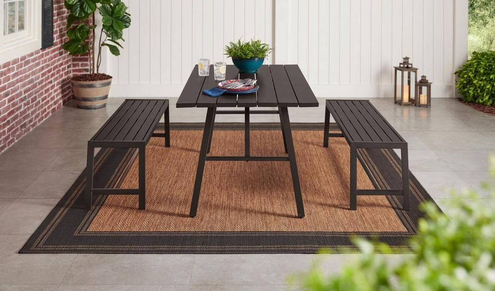 Metal patio set on a large outdoor area rug