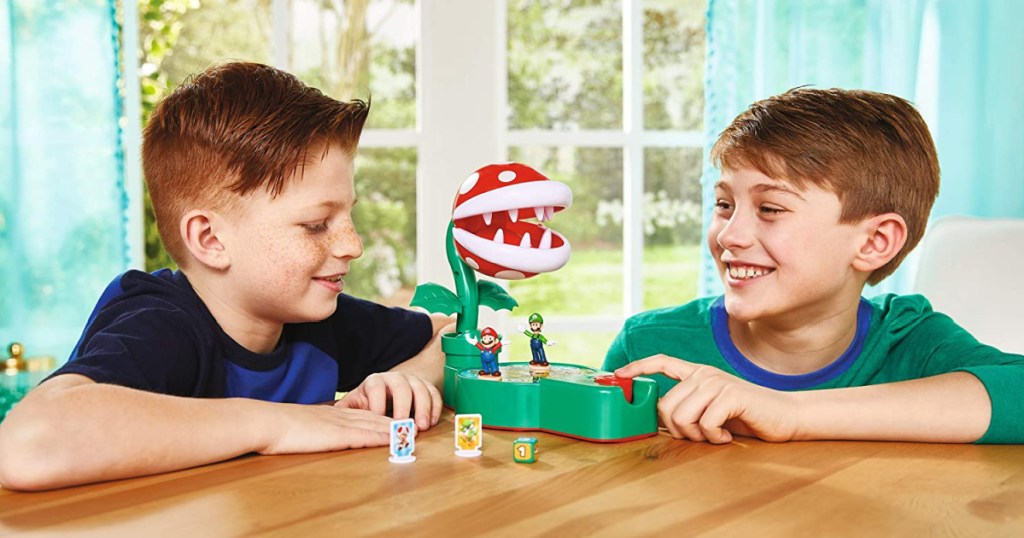 This piranha plant game that these two boys are playing is one of the best Super Mario toys