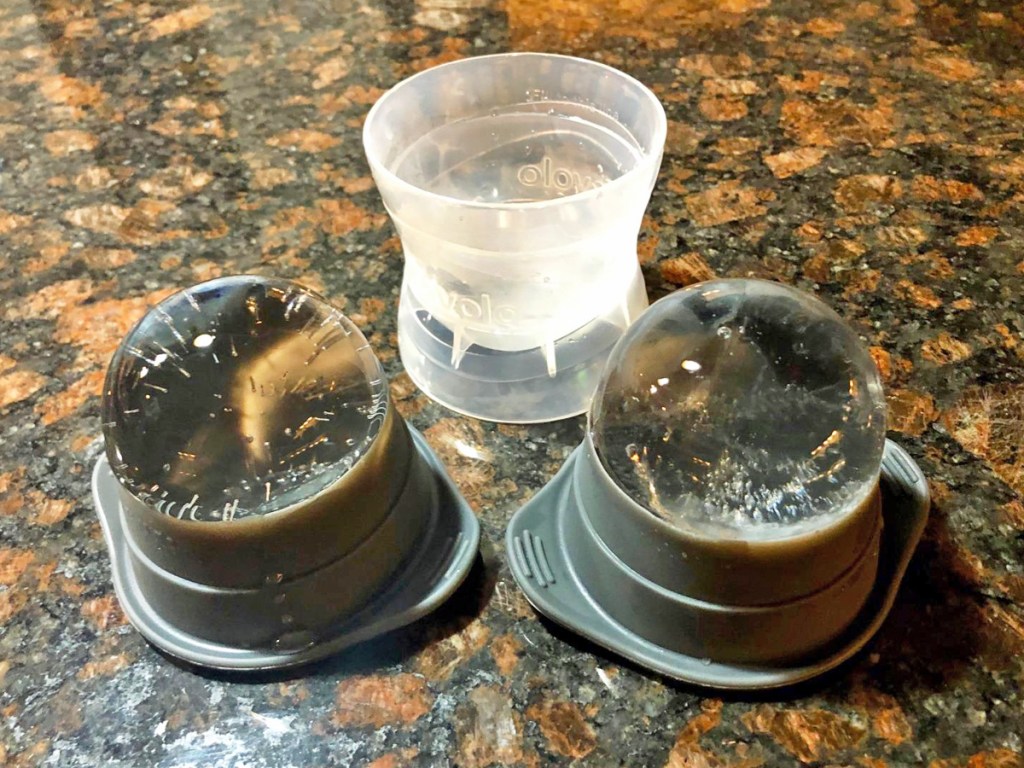 two balls of ice sitting on top of their mold