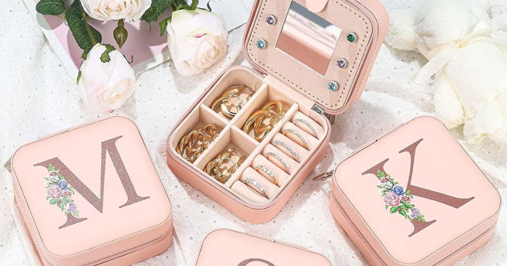 monogrammed pink square jewelry boxes with one opened up revealing jewelry 