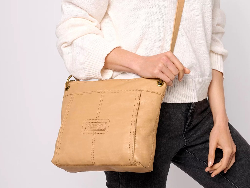 woman wearing american leather company purse