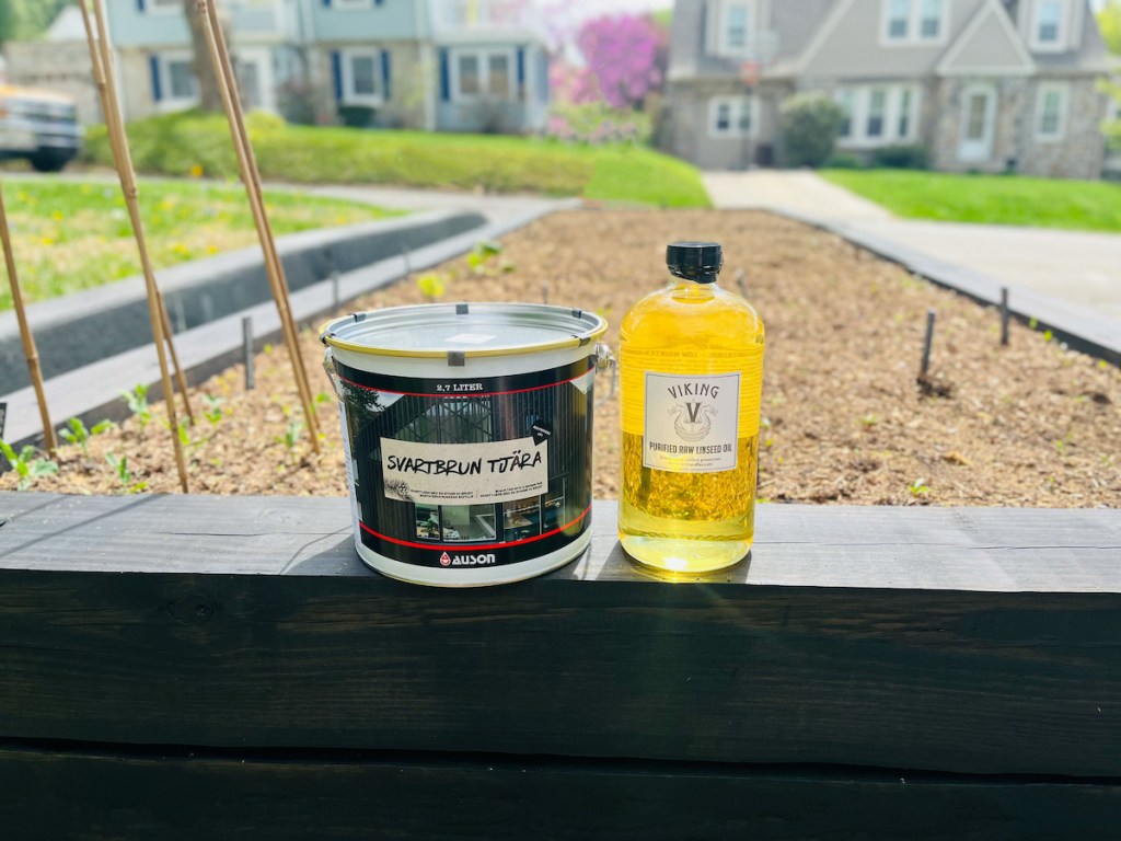 authentic pine tar and raw linseed oil on edge of garden bed