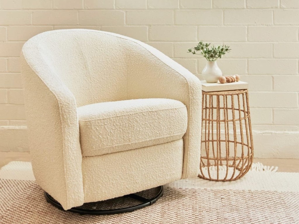ivory chair next to wicker side table