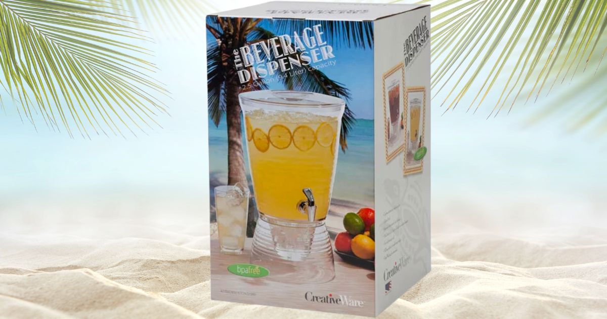A 2.5 gallon drink dispenser box with an image of the dispenser filled with lemonade and ice sitting next to a glass of lemonade and a plate of citrus fruits