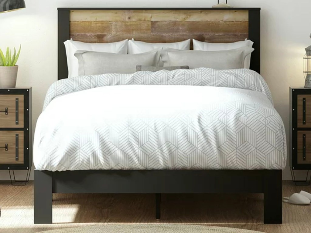 brown queen bedframe with white bedding
