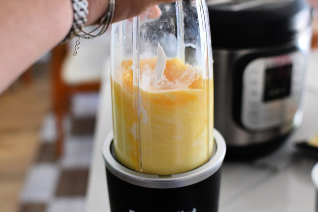 blending eggs and cheese in a nutrabullet