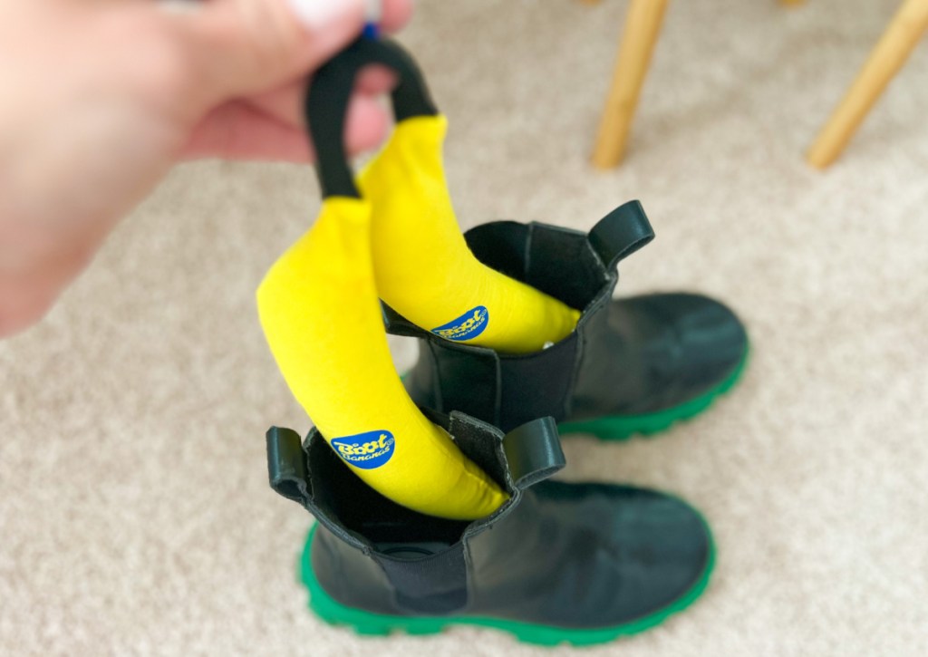 banana shaped shoe deodorizers going into black boots