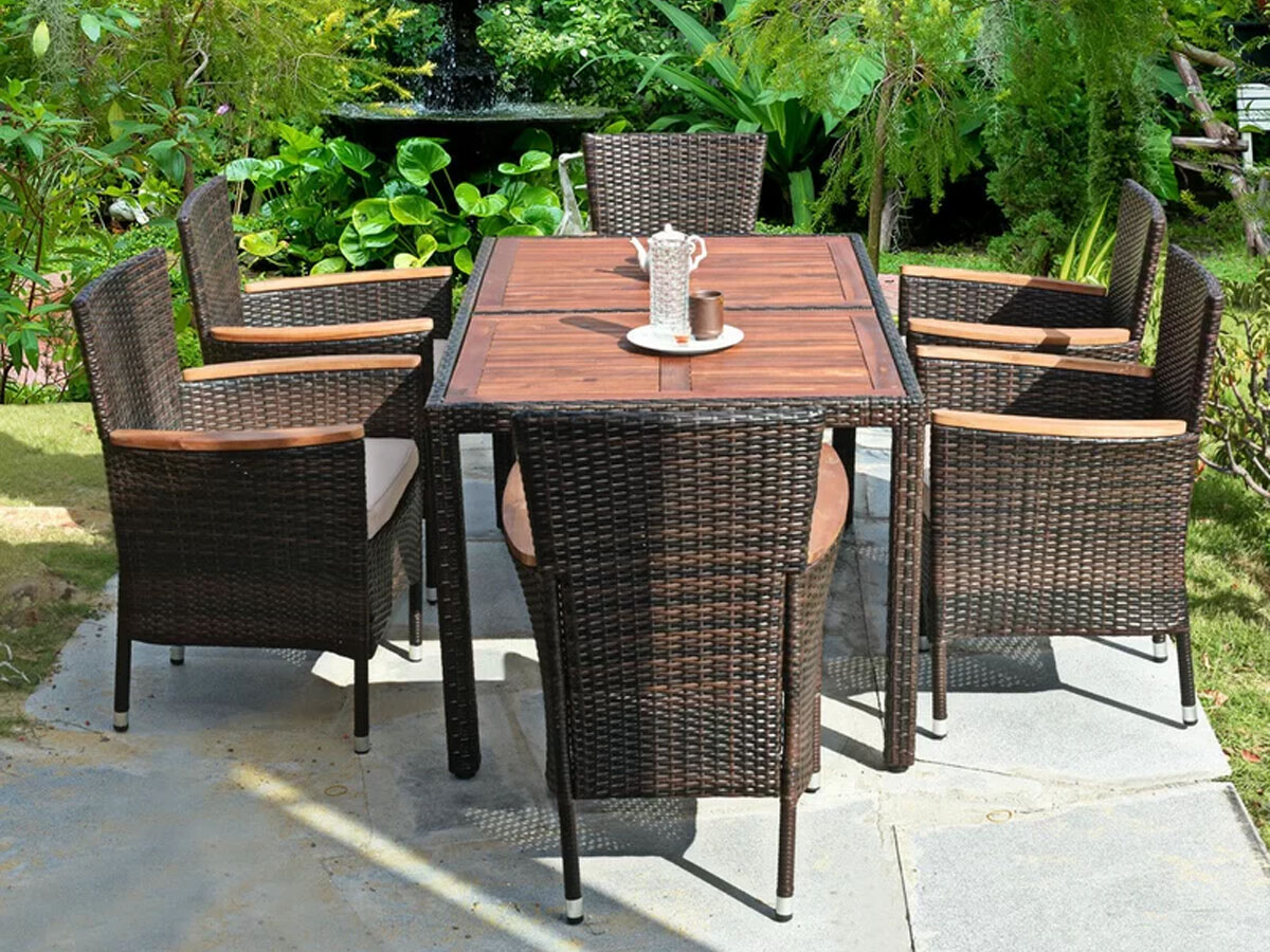 brown wicker patio table with 6 chairs on patio 