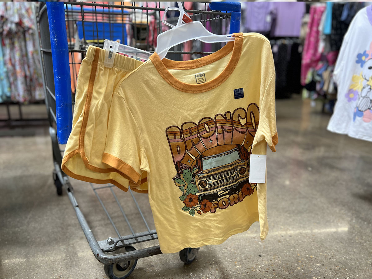 yellow ford bronco pajama set hanging on walmart cart