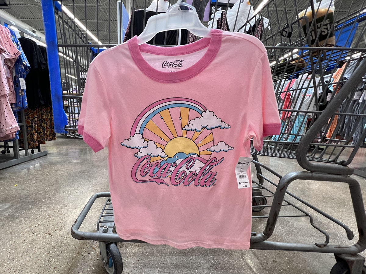 pink coca-cola pajama set hanging on walmart cart