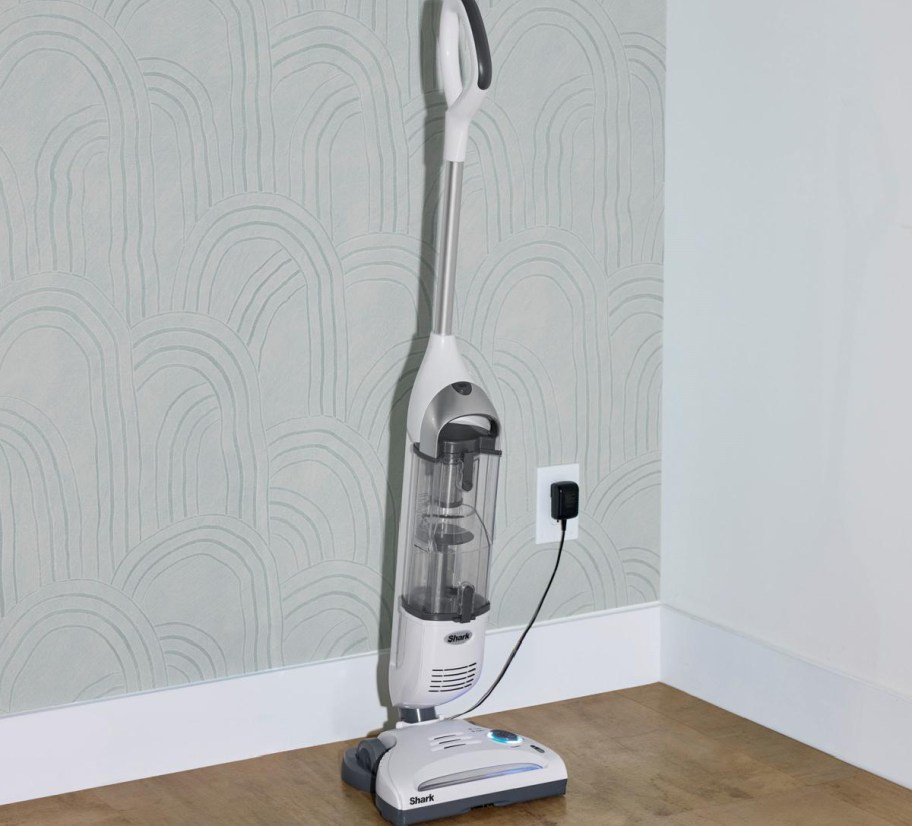 cordless vacuum plugged to the wall charging
