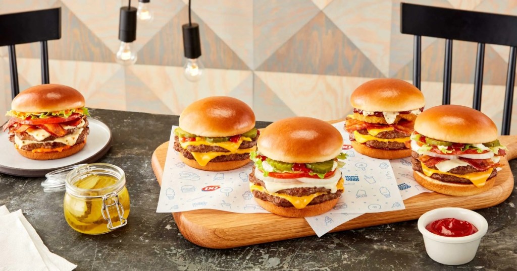 multiple burgers on a table