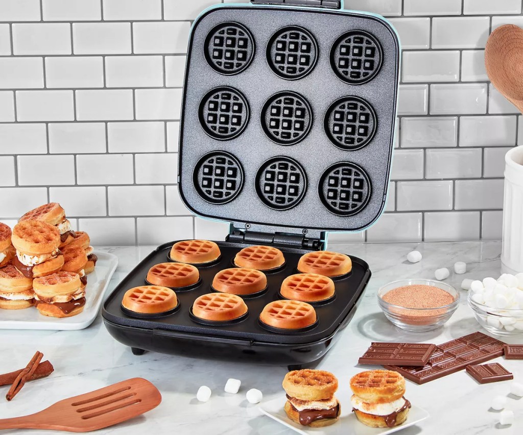 dash waffle bites maker next to waffle sandwiches, marshmallows and Hershey bars