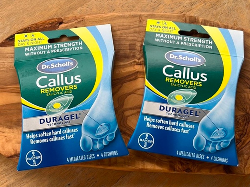 two packs of dr scholl's callus removers on table