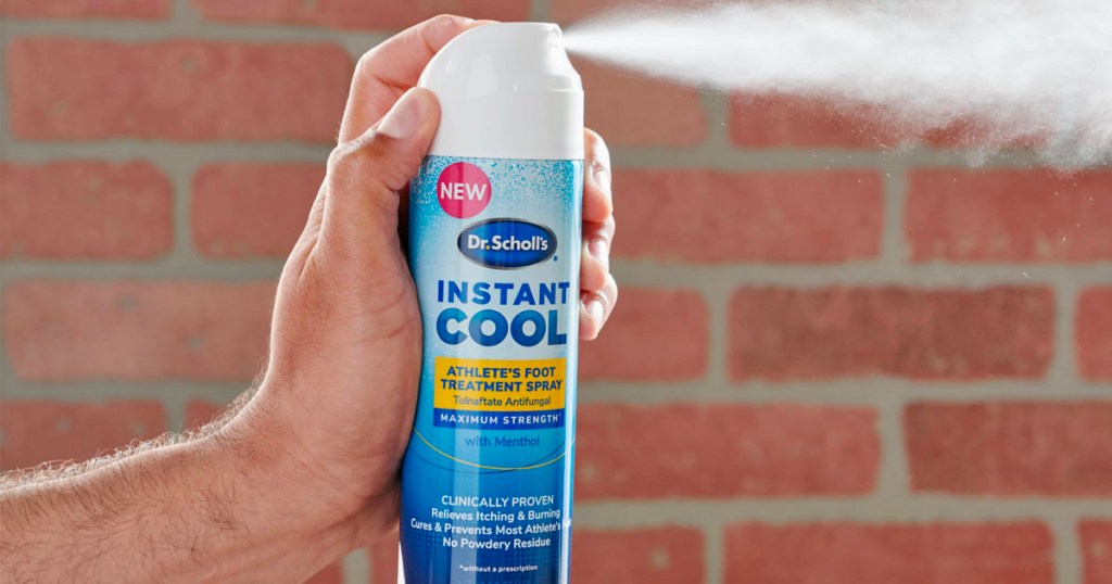 hand spraying dr scholl's instant cool spray