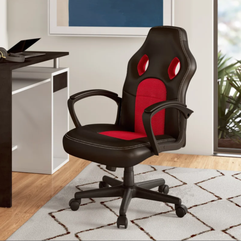 An office with a budget computer and gaming chair from Wayfair