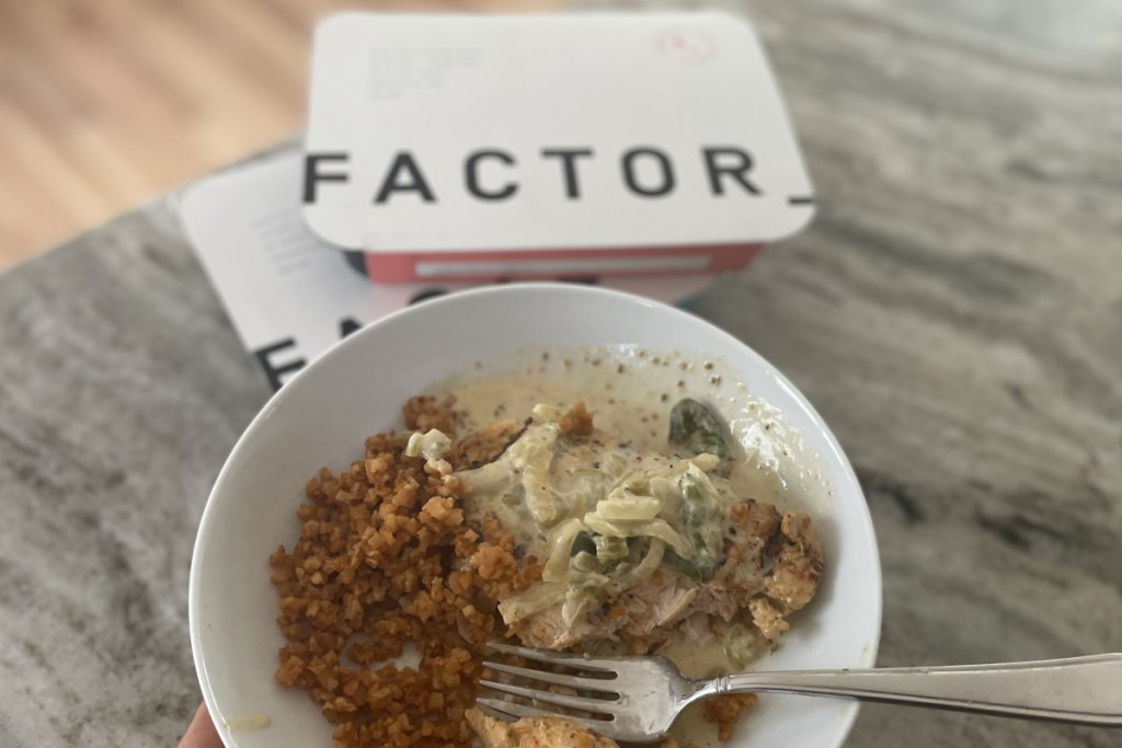 factor meal in bowl next to box