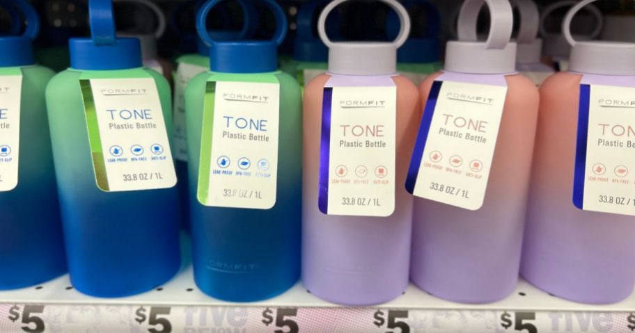 green and blue ombre and pink and purple ombre TONE water bottles on store shelf
