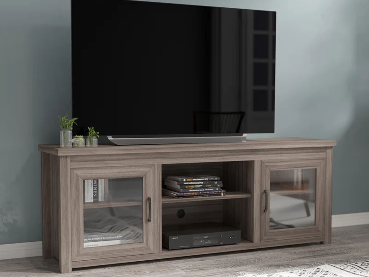 light brown tv stand with tv sitting on it in living room