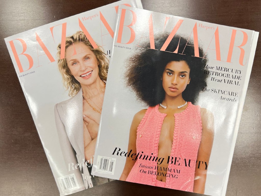two harpers bazaar magazines on table