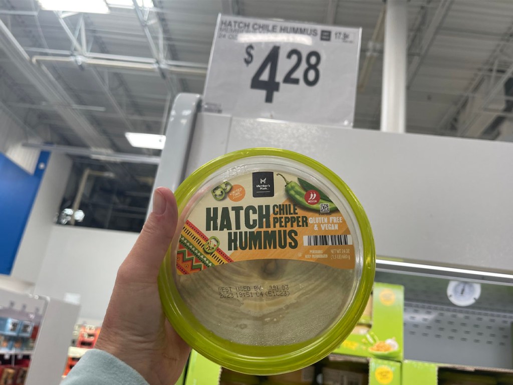 hand holding hatch chili hummus