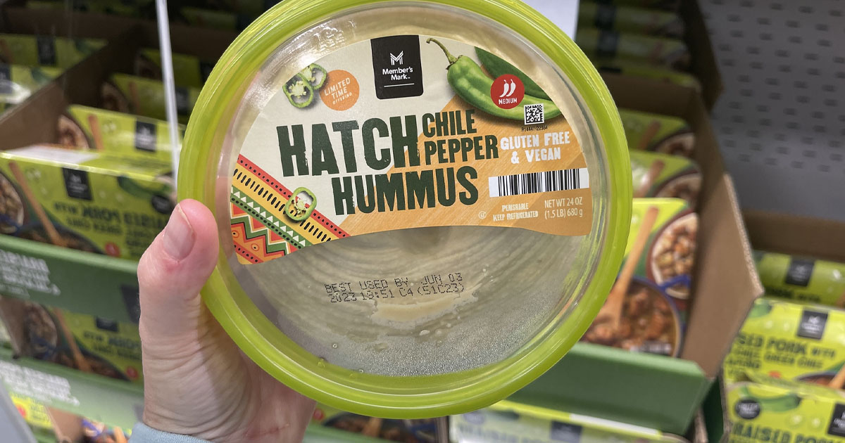 hand holding hatch chili hummus