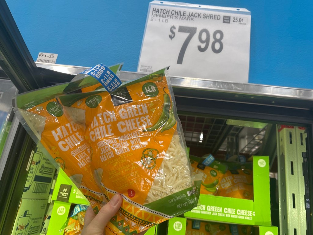 hand holding hatch chili shredded cheese