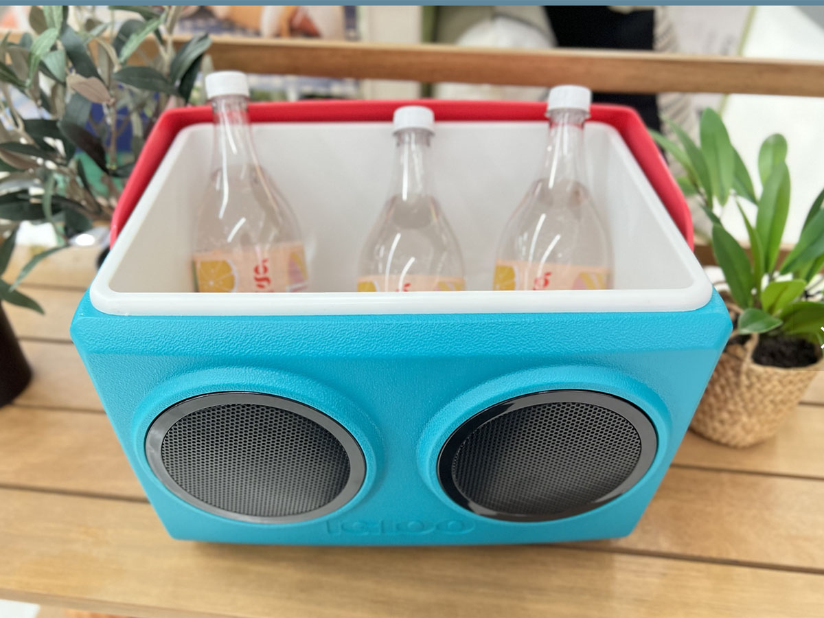 teal and pink kooltunes cooler open with drinks inside