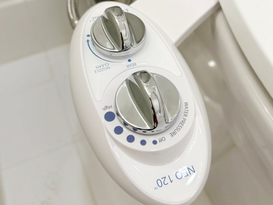 white bidet attached to toilet 