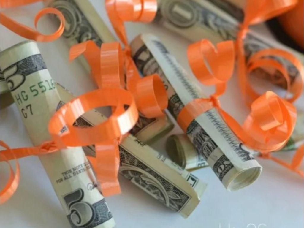 money tied with ribbon