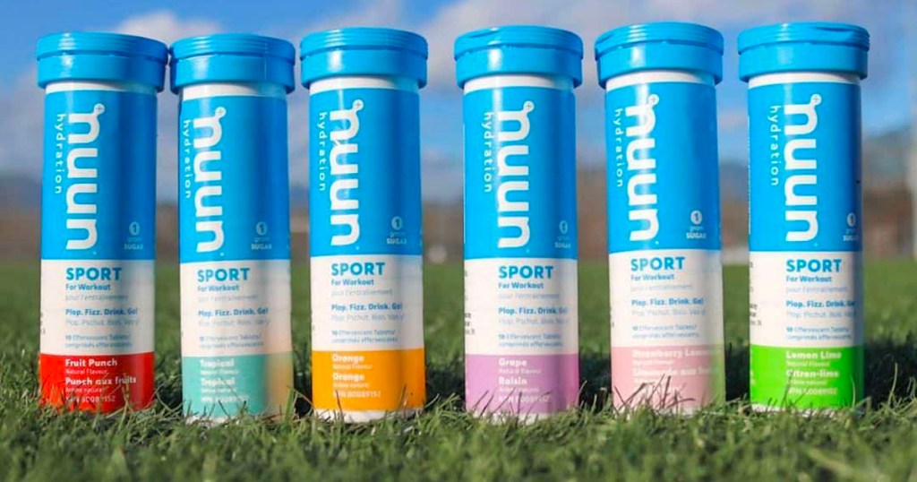 nuun sport hydration tablet bottles in a row on grass