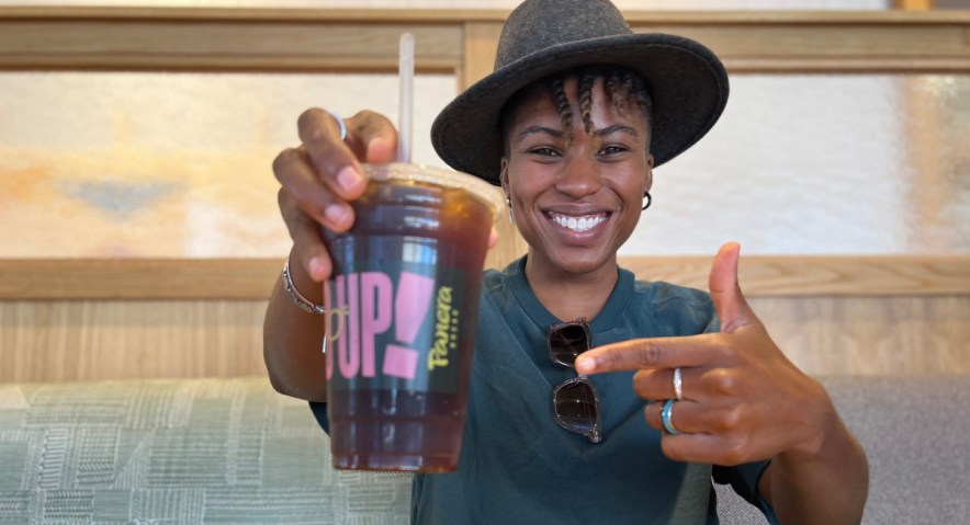 Woman holding Panera drink in hand