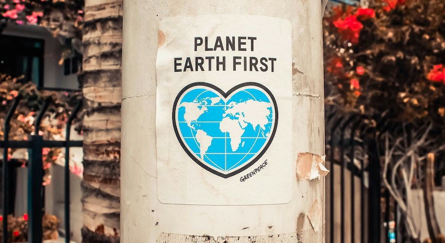 planet earth first sign on street pole 