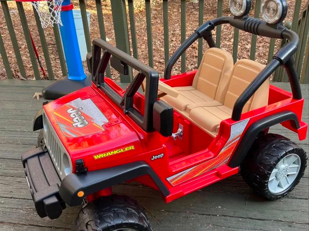 red jeep powerwheels on porch