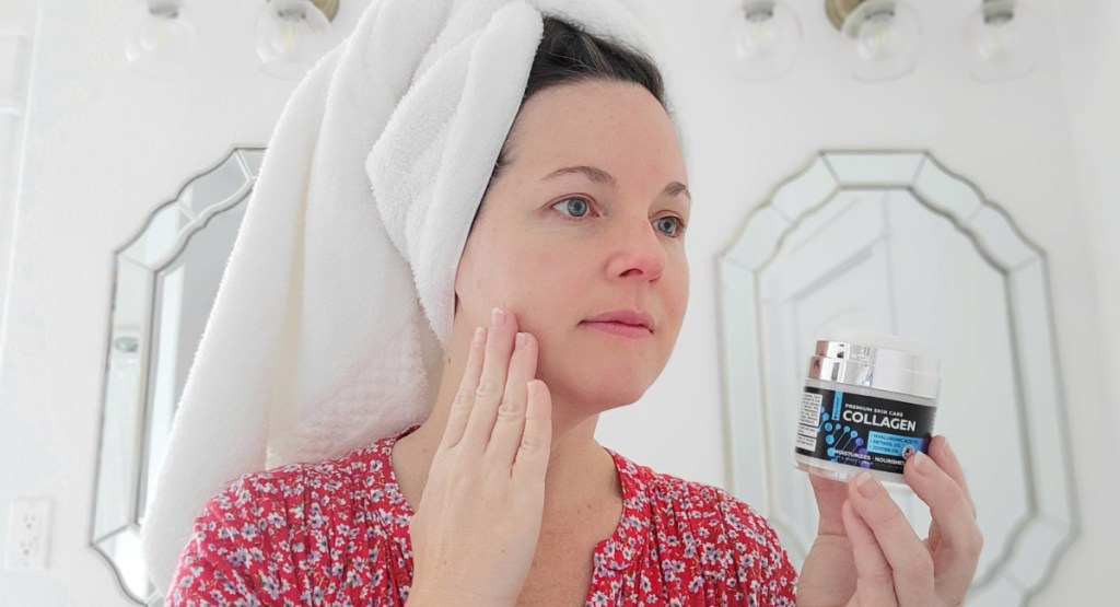 woman rubbing collagen cream on face