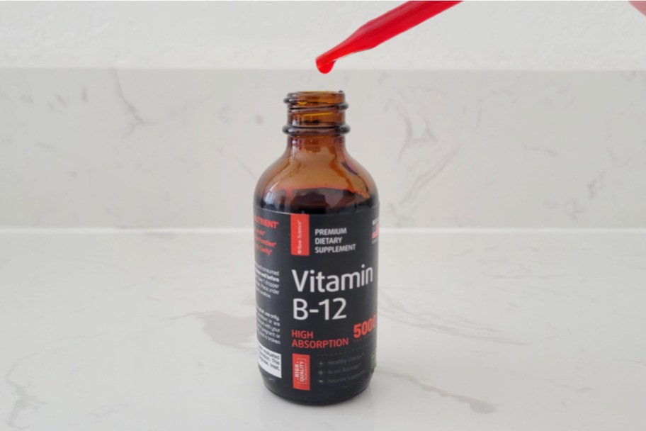 red vitamin b12 drops going into bottle