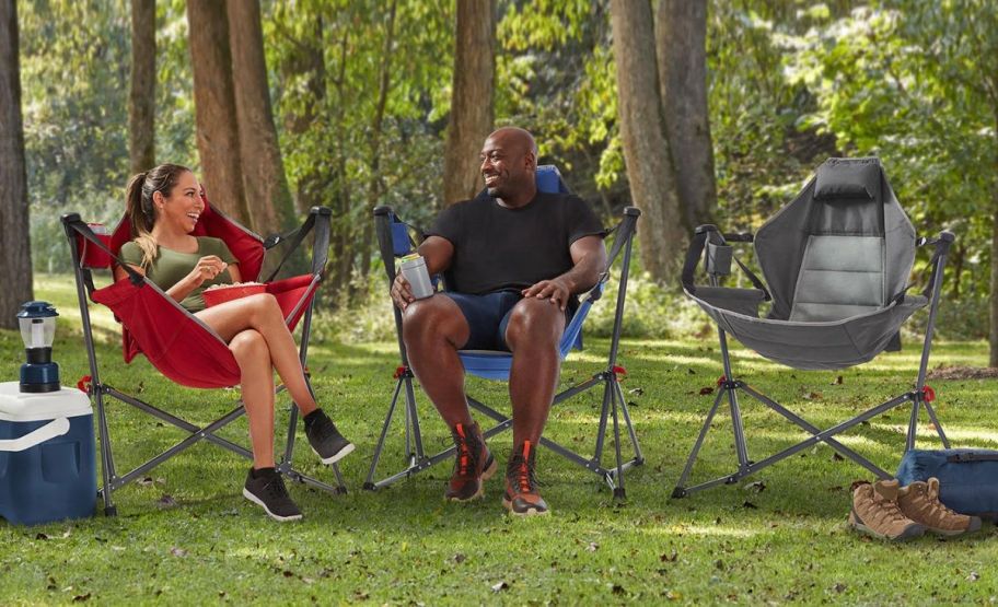 member's mark swing lounger chairs with two people sitting in them outside