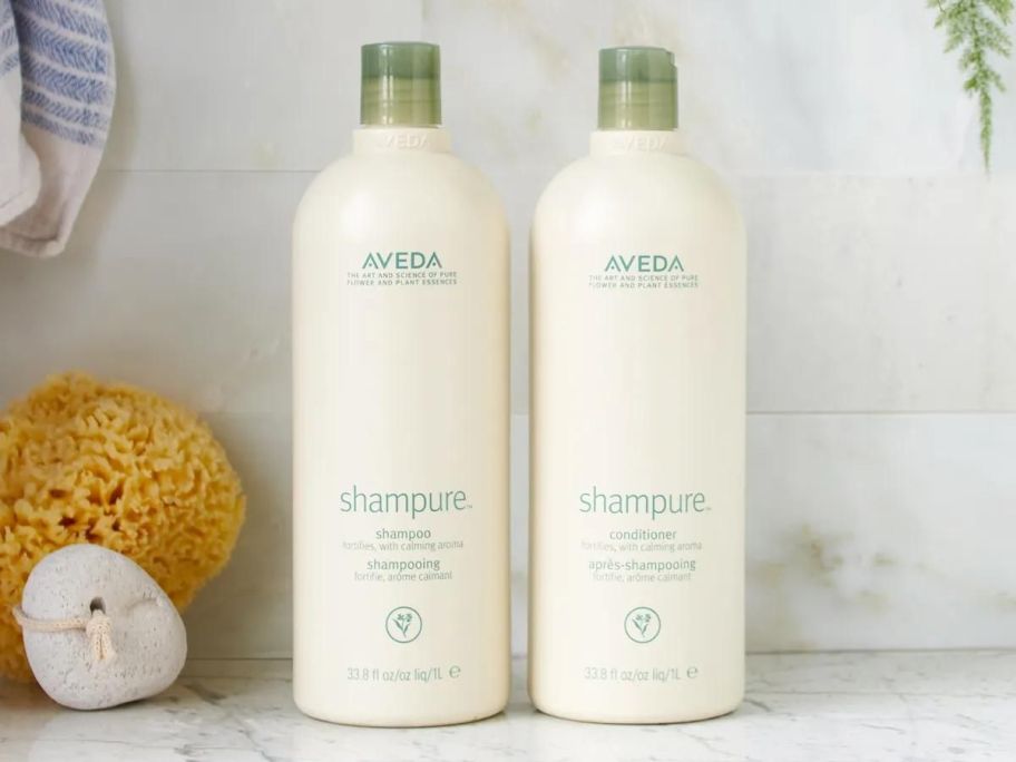 aveda shampure bottles on bathroom counter