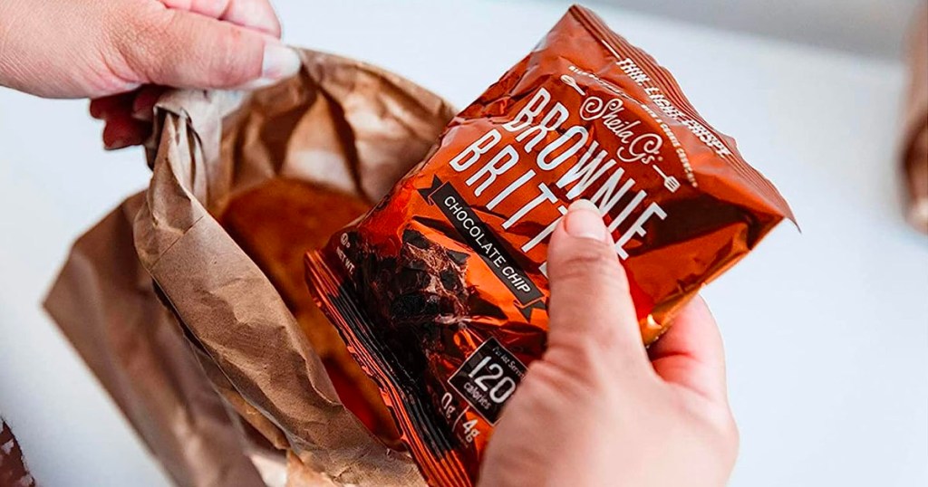 hand holding bag of brownie brittle