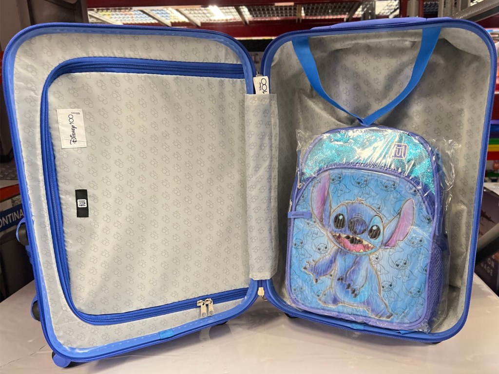 open disney stitch luggage with backpack inside