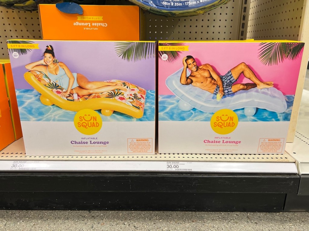 two pool floats in boxes on shelf