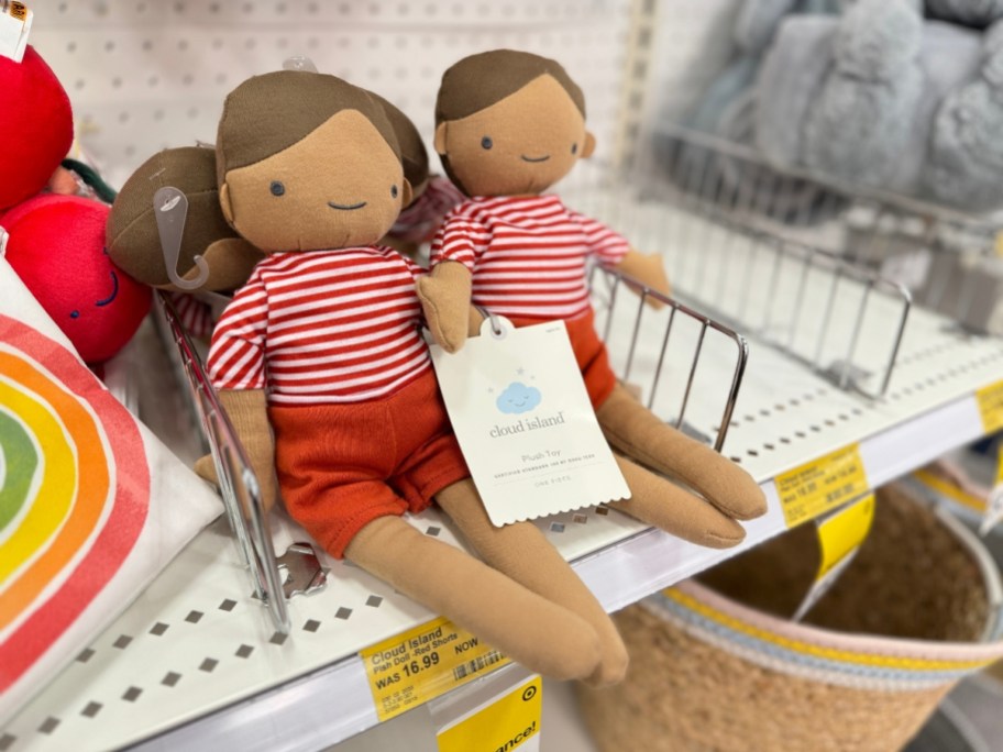 plush kid's dolls with red striped shirts and red shorts on target clearance shelf