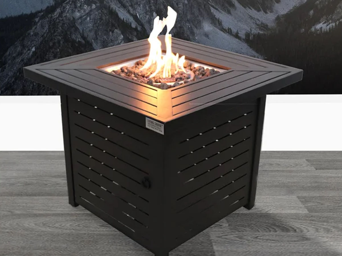 black square firepit table with fire and mountain backdrop