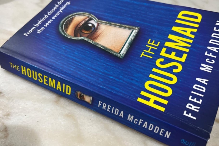 paperback copy of The Housemaid